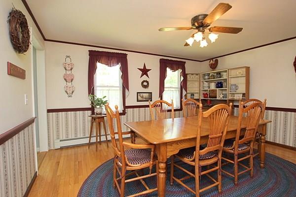 40 Old Farm Road North Attleboro, MA 02760 - Photo 16 of 36 a dining room with furniture a chandelier and wooden floor