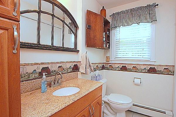 40 Old Farm Road North Attleboro, MA 02760 - Photo 19 of 36 a bathroom with a granite countertop sink and a mirror