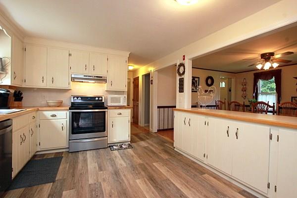 40 Old Farm Road North Attleboro, MA 02760 - Photo 22 of 36 a kitchen with granite countertop a refrigerator and a stove top oven