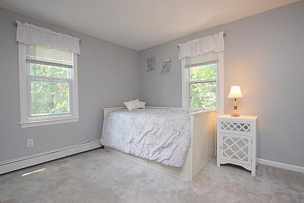40 Old Farm Road North Attleboro, MA 02760 - Photo 26 of 36 a spacious bedroom with a bed and a window