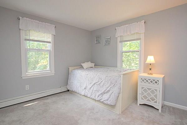 40 Old Farm Road North Attleboro, MA 02760 - Photo 29 of 36 a spacious bedroom with a bed a window and potted plant on the dresser