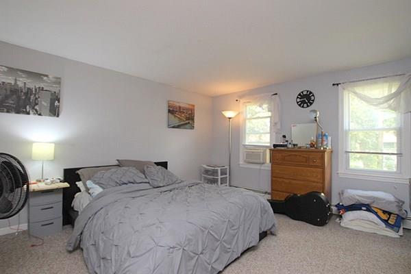 40 Old Farm Road North Attleboro, MA 02760 - Photo 30 of 36 a bedroom with a bed a couch and a window
