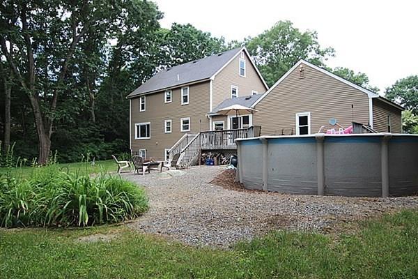 40 Old Farm Road North Attleboro, MA 02760 - Photo 8 of 36 a view of a house with a yard plants and large tree