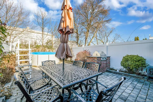 a view of an outside dining space with furniture