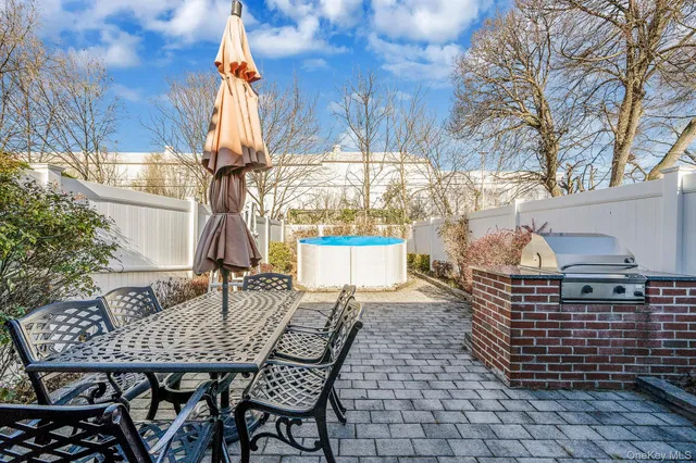 a outdoor dining space with furniture and garden view
