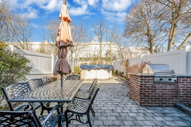 a outdoor dining space with furniture and garden view