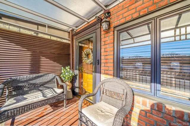 a view of a two chairs in the balcony