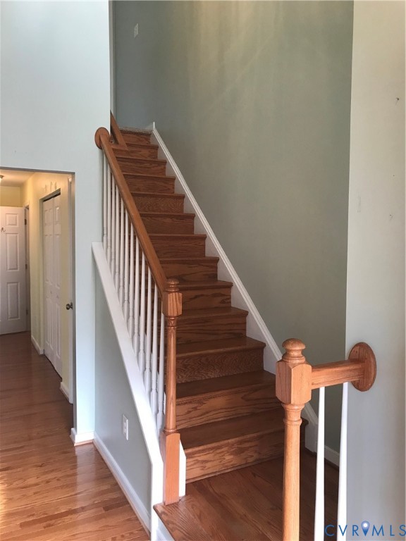 13628 Baycraft Terrace Midlothian, VA 23112 - Photo 18 of 24 a view of staircase with wooden floor and white walls