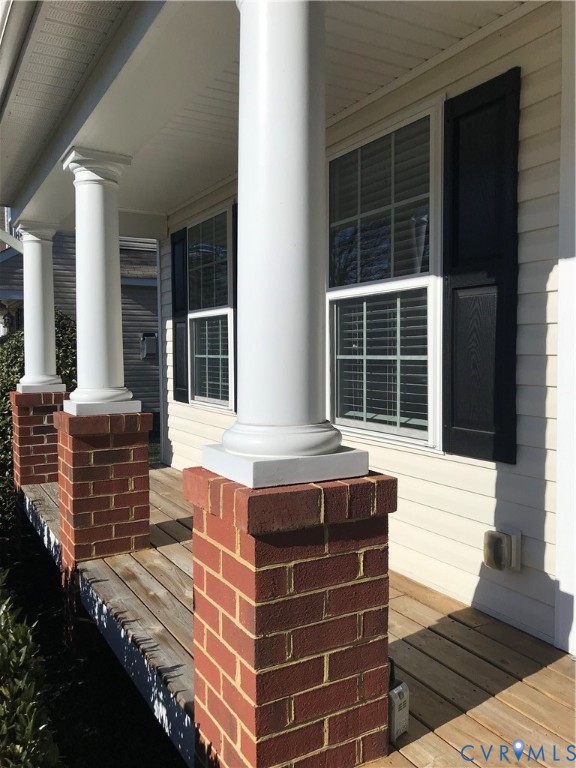 13628 Baycraft Terrace Midlothian, VA 23112 - Photo 3 of 24 a balcony with table and chairs