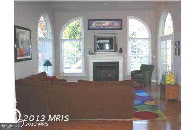 9129 Travener Circle Frederick, MD 21704 - Photo 12 of 28 a living room with furniture and a fireplace
