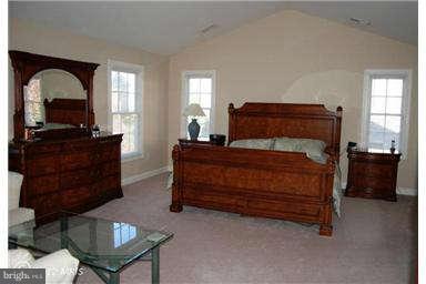 9129 Travener Circle Frederick, MD 21704 - Photo 16 of 28 a bedroom with a bed window and dresser