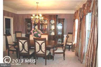9129 Travener Circle Frederick, MD 21704 - Photo 3 of 28 a view of a dining room with furniture and chandelier