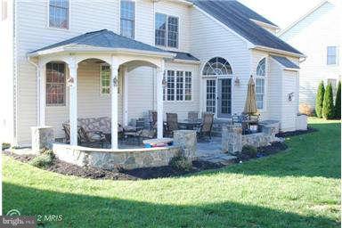9129 Travener Circle Frederick, MD 21704 - Photo 25 of 28 a front view of a house with garden