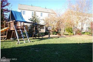 9129 Travener Circle Frederick, MD 21704 - Photo 27 of 28 a view of a yard with a slide