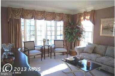 9129 Travener Circle Frederick, MD 21704 - Photo 5 of 28 a living room with furniture and a large window