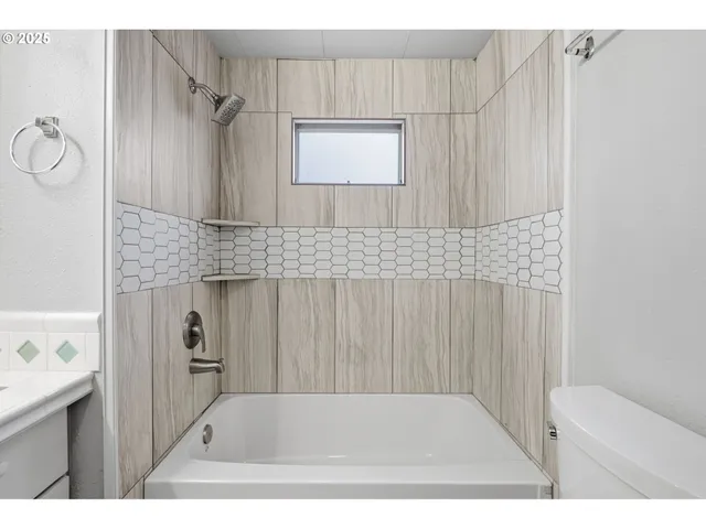 a bathroom with a sink a mirror and a shower