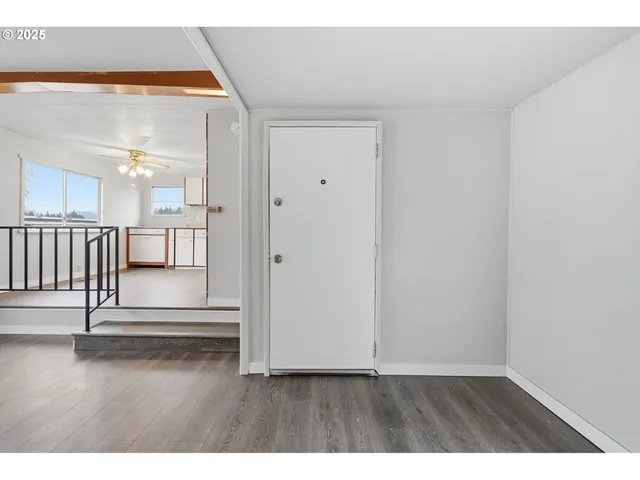 a view of entryway with wooden floor