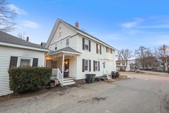 72 Main Street Pepperell, MA 01463 - Photo 1 of 26 a front view of a house with a yard