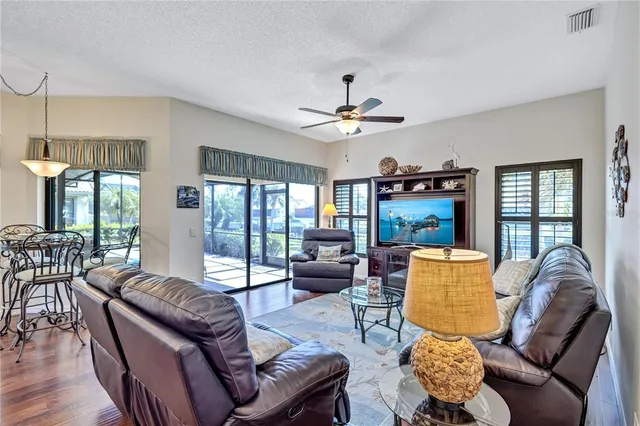 a bed room with a bed and a chair