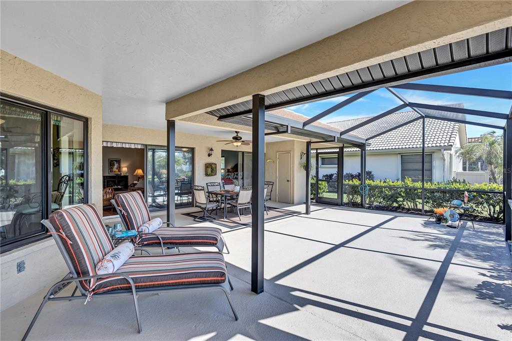 104 Inlets Boulevard, Unit 104 Nokomis, FL 34275 - Photo 28 of 66 a outdoor living space with patio furniture and potted plants