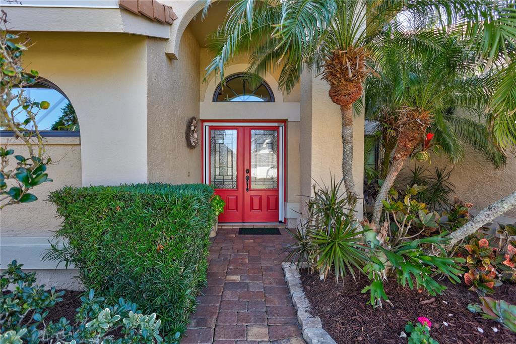 104 Inlets Boulevard, Unit 104 Nokomis, FL 34275 - Photo 3 of 66 a front view of a house with garden