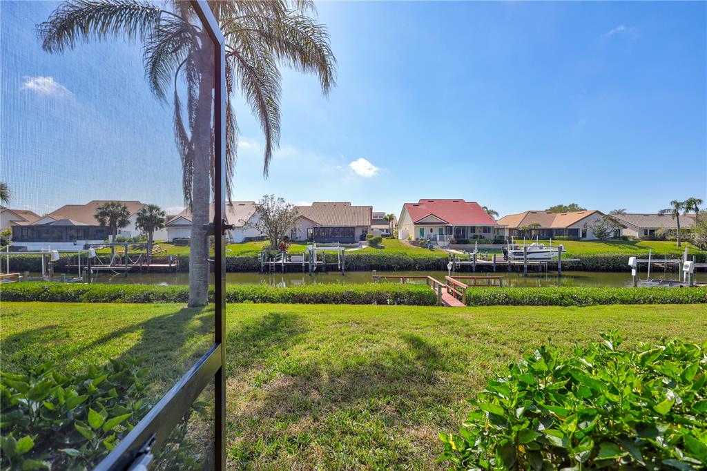 104 Inlets Boulevard, Unit 104 Nokomis, FL 34275 - Photo 46 of 66 a view of a garden with a lake view