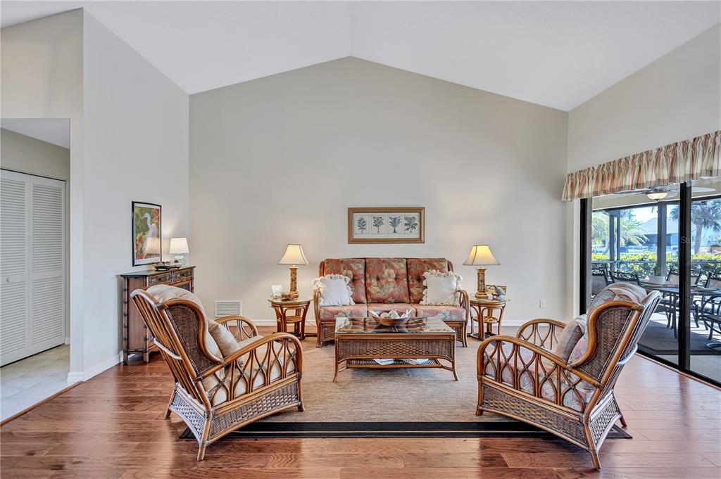 104 Inlets Boulevard, Unit 104 Nokomis, FL 34275 - Photo 5 of 66 a living room with furniture and a table