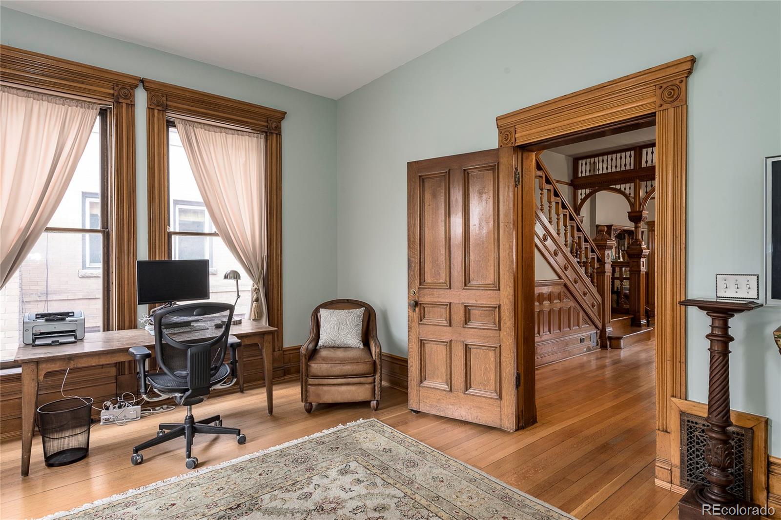 131 Sherman Street Denver, CO 80203 - Photo 14 of 36 a view of a livingroom with workspace and a window