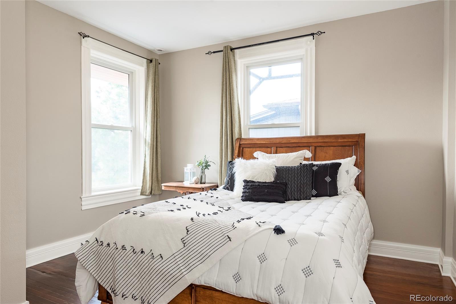 131 Sherman Street Denver, CO 80203 - Photo 23 of 36 a bedroom with a bed and a window