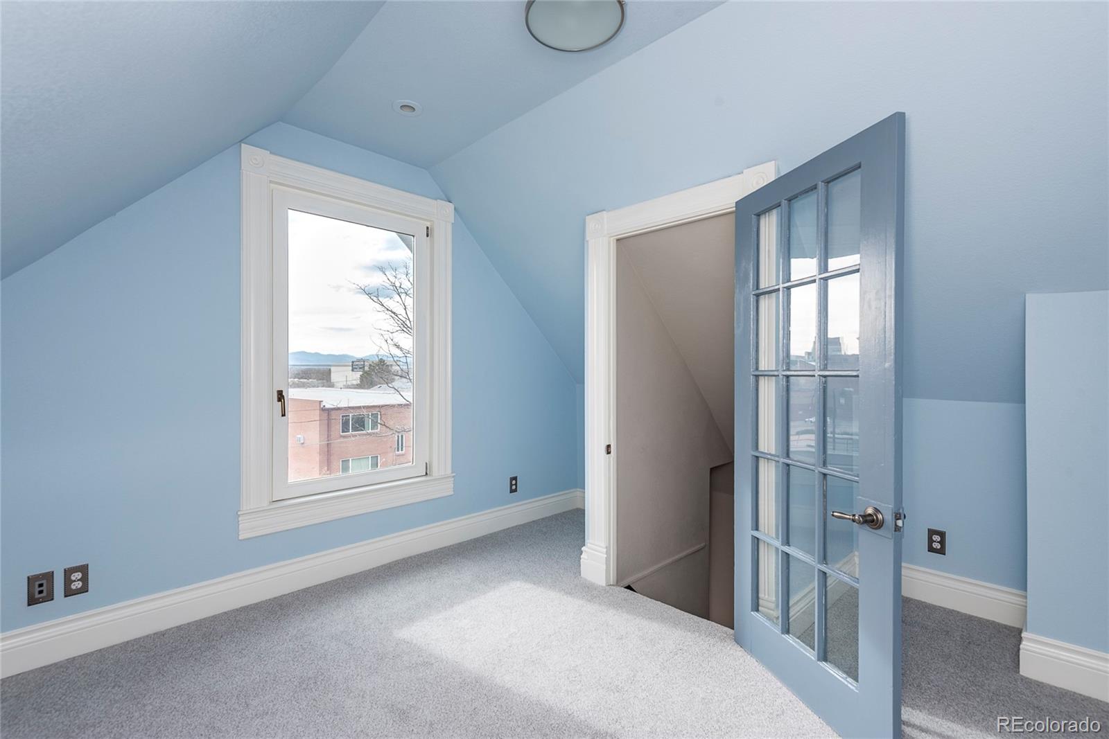 131 Sherman Street Denver, CO 80203 - Photo 27 of 36 an empty room with windows