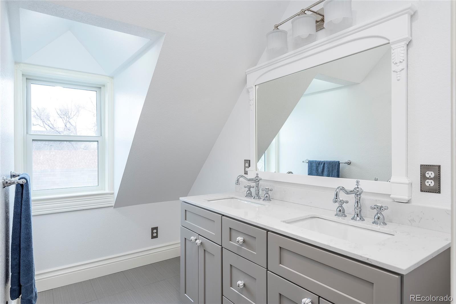 131 Sherman Street Denver, CO 80203 - Photo 29 of 36 a bathroom with a sink vanity granite tub and a mirror