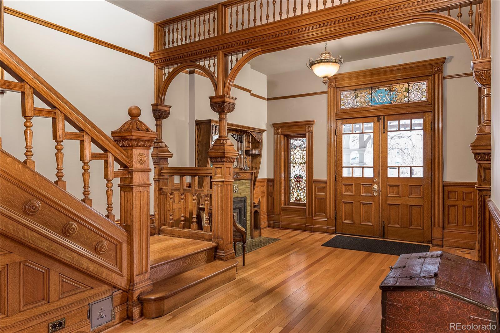 131 Sherman Street Denver, CO 80203 - Photo 3 of 36 a view of an entryway with wooden floor