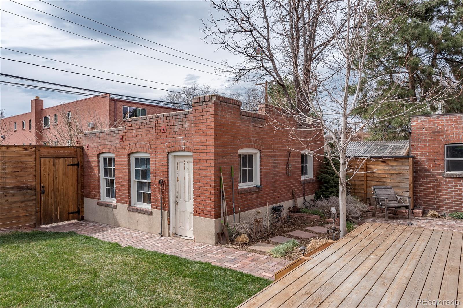 131 Sherman Street Denver, CO 80203 - Photo 32 of 36 a view of a house with a yard