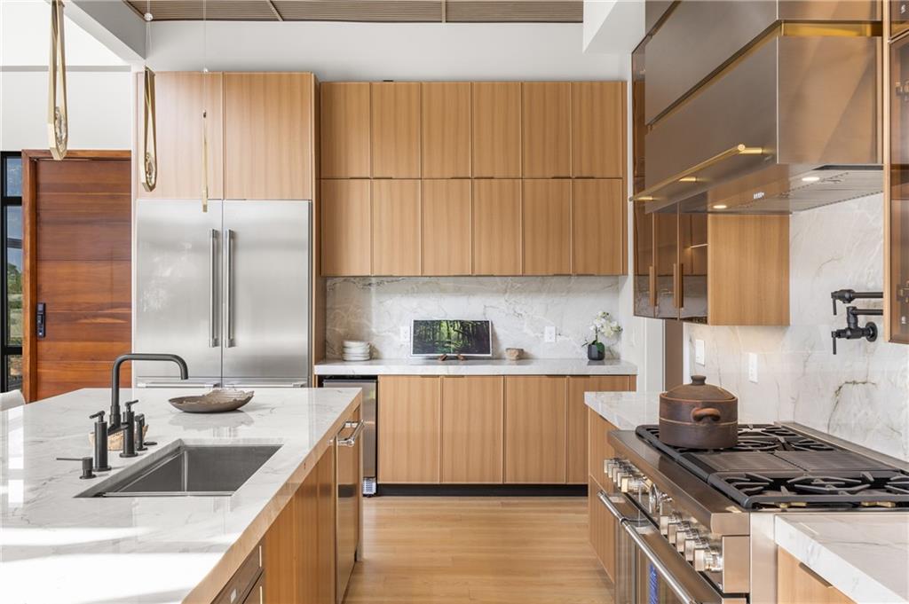 4232 Edgewood Court Marietta, GA 30068 - Photo 28 of 72 a kitchen with stainless steel appliances granite countertop a sink stove and refrigerator