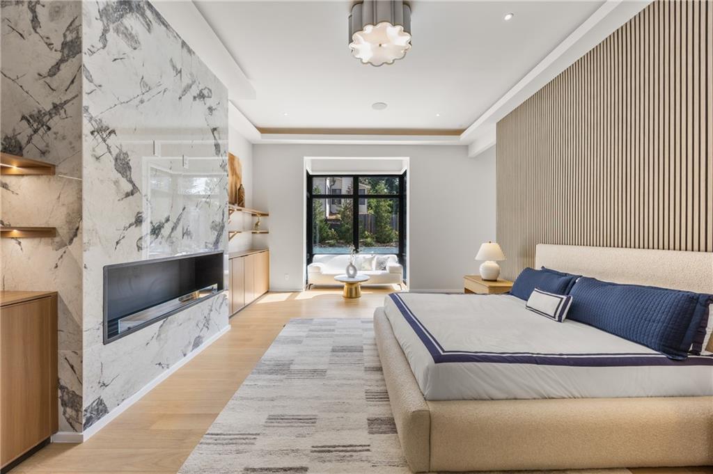 4232 Edgewood Court Marietta, GA 30068 - Photo 36 of 72 a living room with furniture a flat screen tv and a fireplace