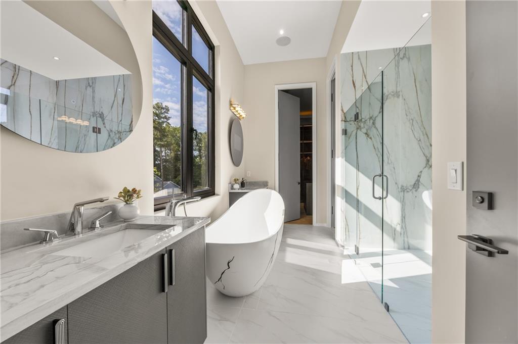 4232 Edgewood Court Marietta, GA 30068 - Photo 40 of 72 a bathroom with a double vanity sink mirror and shower