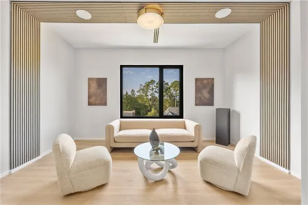 a living room with furniture and a large window