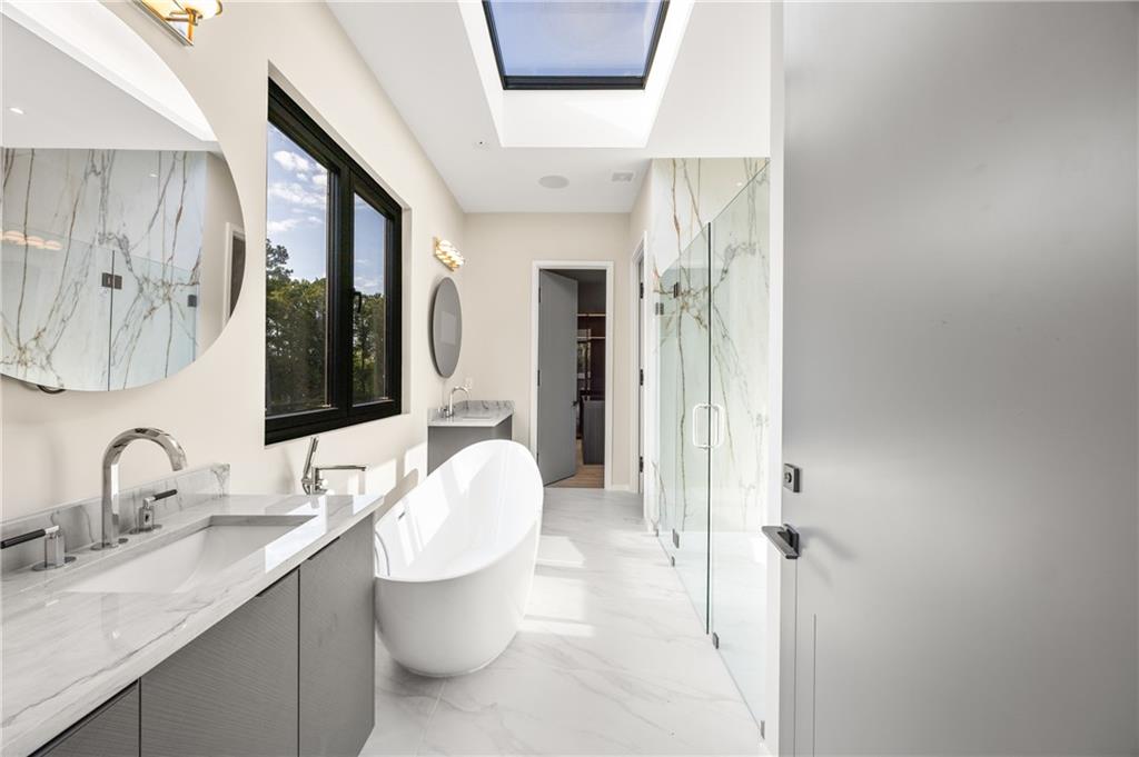 4232 Edgewood Court Marietta, GA 30068 - Photo 49 of 72 a bathroom with a double vanity sink double mirror and toilet