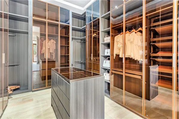 an aerial view of a house with a garden and trees