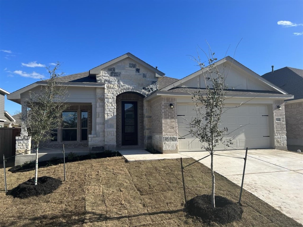 122 Biscayne Bay Bend Kyle, TX 78640 - Photo 1 of 1 a front view of a house with garden