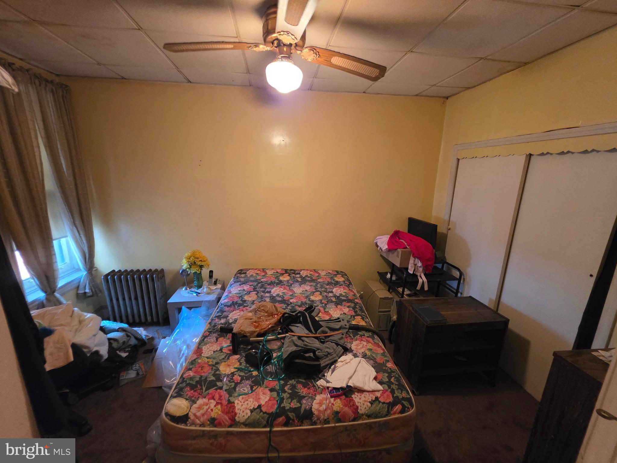 1317 East Rittenhouse Street Philadelphia, PA 19138 - Photo 10 of 16 a bedroom with a bed and a chandelier
