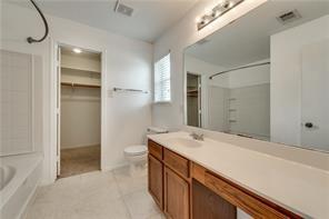 2112 Pecan Creek Drive Mesquite, TX 75181 - Photo 7 of 11 a bathroom with a sink and a mirror