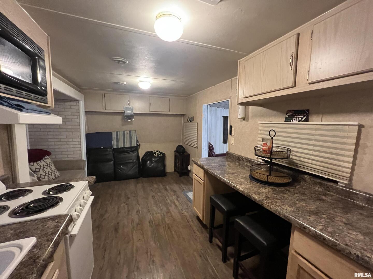 4 Victory Lane Marion, IL 62959 - Photo 14 of 26 a kitchen with sink refrigerator and cabinets
