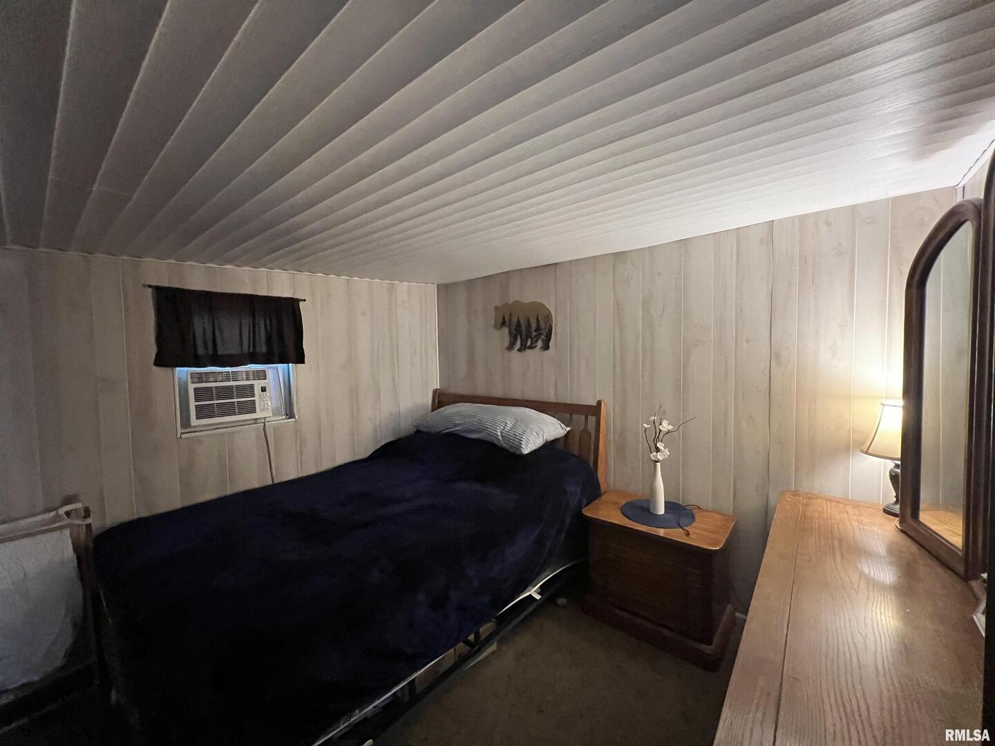 4 Victory Lane Marion, IL 62959 - Photo 15 of 26 a bedroom with a bed wooden floor and a television