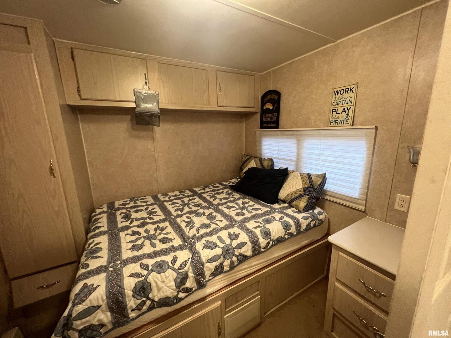 4 Victory Lane Marion, IL 62959 - Photo 20 of 26 a bed sitting in a bedroom next to a window