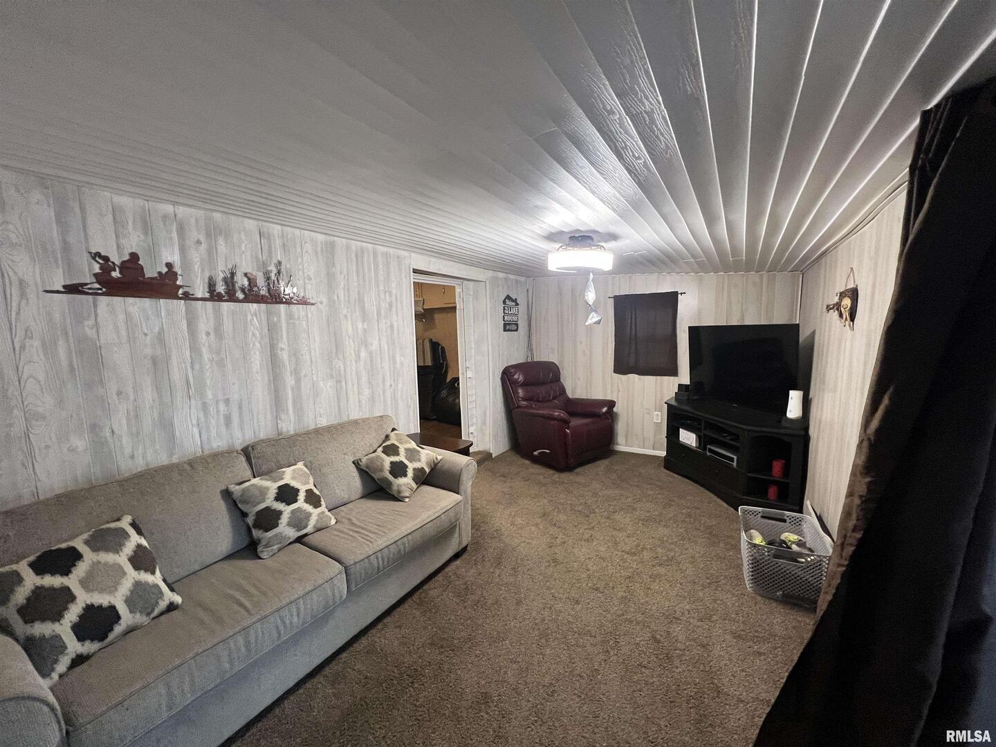 4 Victory Lane Marion, IL 62959 - Photo 10 of 26 a living room with furniture a flat screen tv and a window
