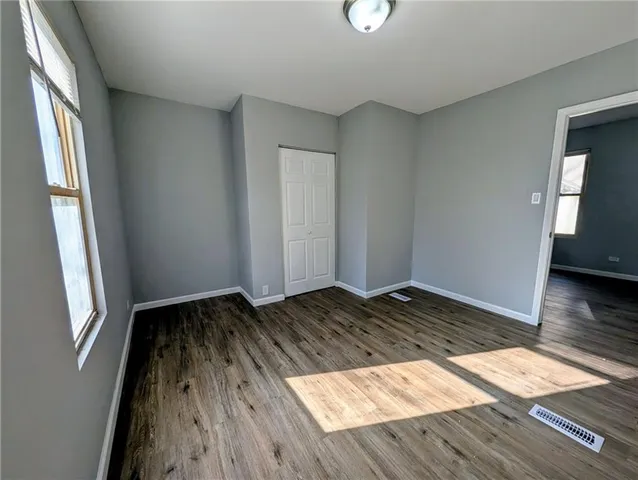 a view of wooden floor in an empty room