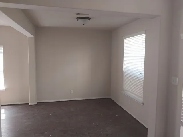 an empty room with windows