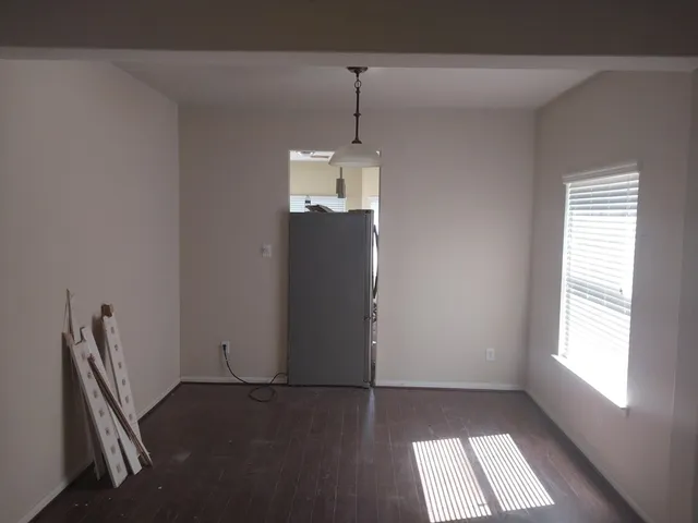 a view of staircase with white walls and windows