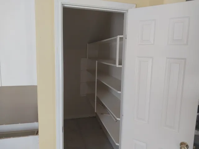 a room that has a window and a table in it